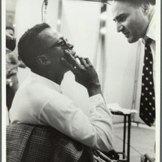 Miles Davis and George Avakian in the recording studio, with John Coltrane in the background, 1955-1956. Image ID: 5404614