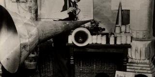 A man is shown working on a device composed of conical shapes of varying devices