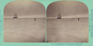 Photo of a ship in the distance going through icy water, and a silhouette of a man standing a little closer to the camera.