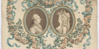 Photograph of a silk textile featuring two profile portraits within ovals surrounded by a decorative floral border