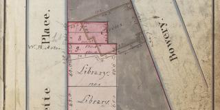Photograph of an old, yellowing map depicting three intersecting streets. There is some handwriting on the map