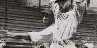 1930–1950, double exposure photograph of an American Negro League Baseball player throwing a baseball - FLY BALL - COPYRIGHT MORGAN and MARVIN SMITH