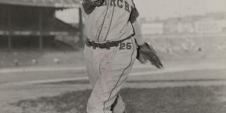 1940, Satchel Paige throwing a ball as a member of the Kansas City Monarchs, American Negro League Baseball Team - COPYRIGHT MORGAN and MARVIN SMITH