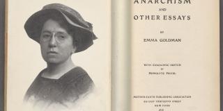 An open book showing the title page on the right side and an illustration of a woman wearing a hat and glasses on the left page