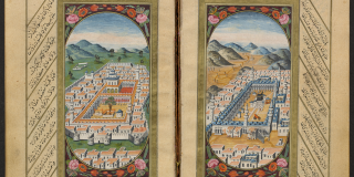 Historic book opened up to pages that each depict ornately painted cities, Mecca and Medina, surrounded by flowers and lines of text in Arabic that radiate around the border of the illustrations. 