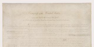 Handwritten copy of the Bill of Rights; slightly browned paper with faded text