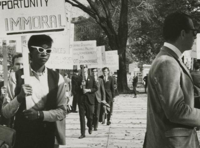 Ernestine Eckstein in a picket line with sign