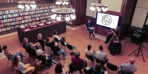 Guests watching a presentation in the Lenox & Astor Room.