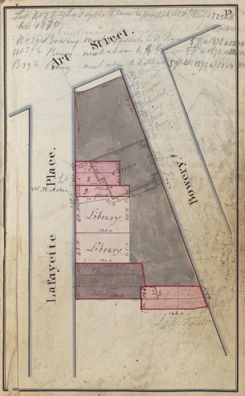 Photograph of an old, yellowing map depicting three intersecting streets. There is some handwriting on the map